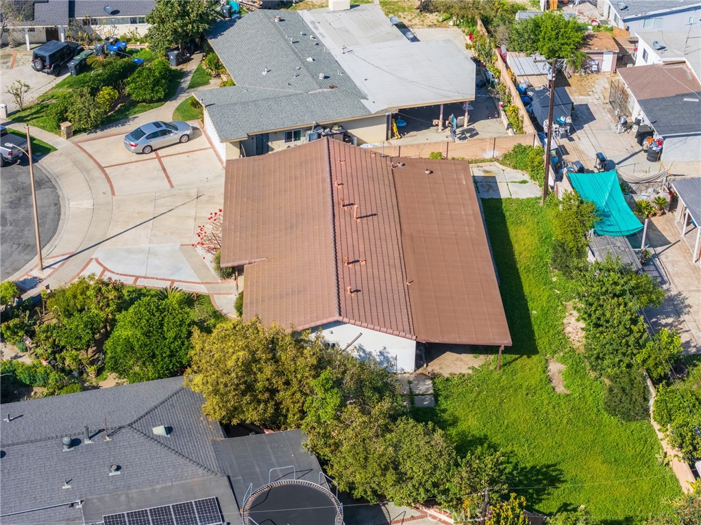 4202 Fay Circle Santa Ana, CA 92703 - Photo 4 of 22 an aerial view of a house with garden space and street view
