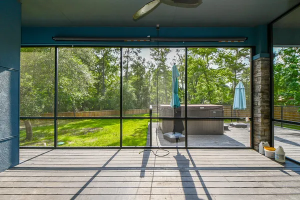 a view of a room with wooden floor and outdoor seating