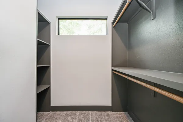 a view of walk in closet with window