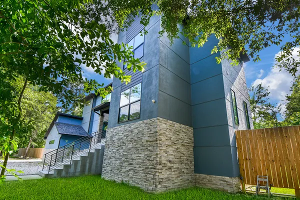 front view of a house with a garden
