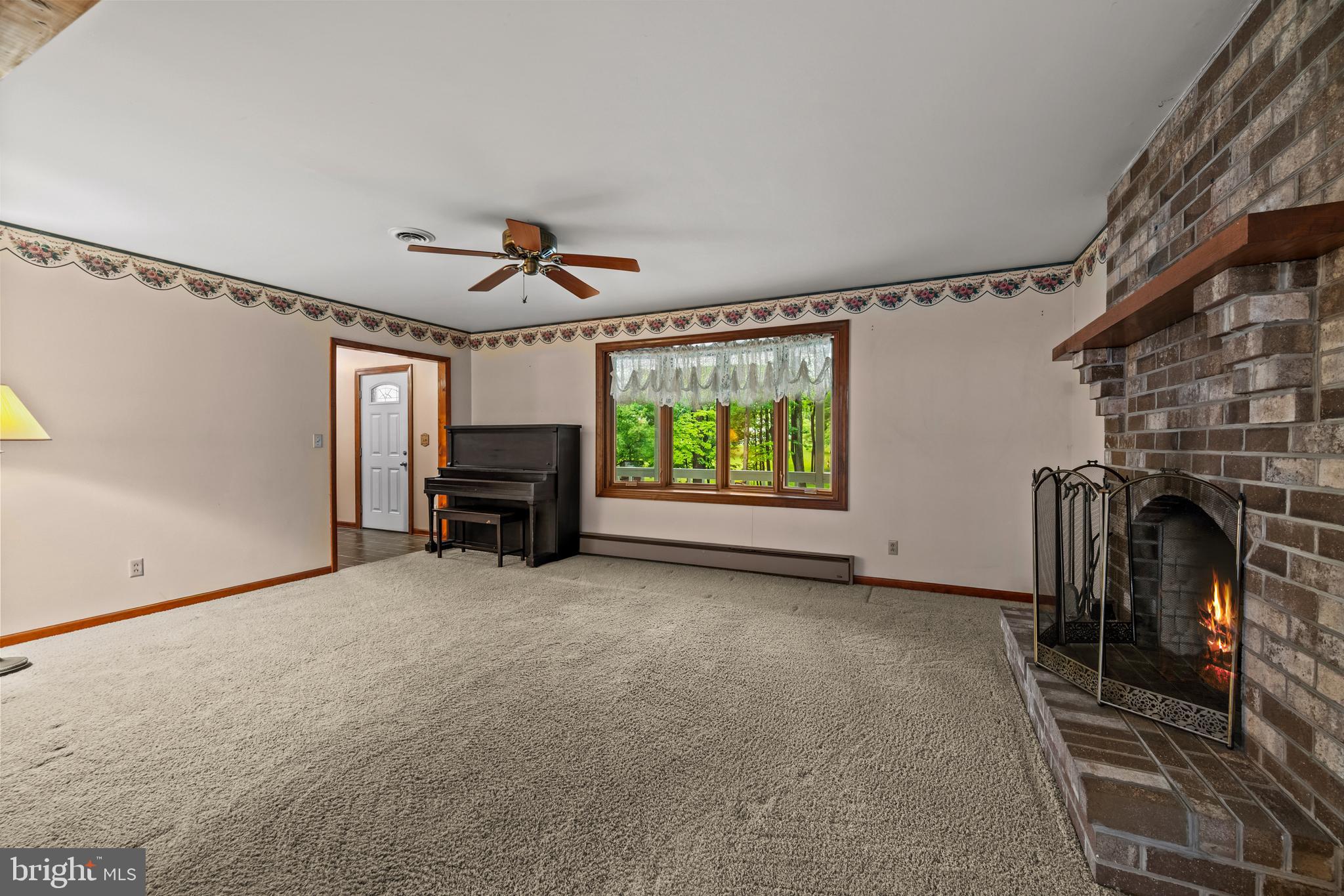 5313 Wentz Road Manchester, MD 21102 - Photo 30 of 51 a view of a livingroom with furniture and a ceiling fan