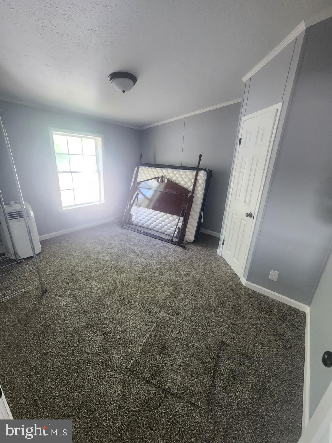 2110 Mays Landing Road, Unit 199 Millville, NJ 08332 - Photo 16 of 18 a spacious bedroom with a bed and a window