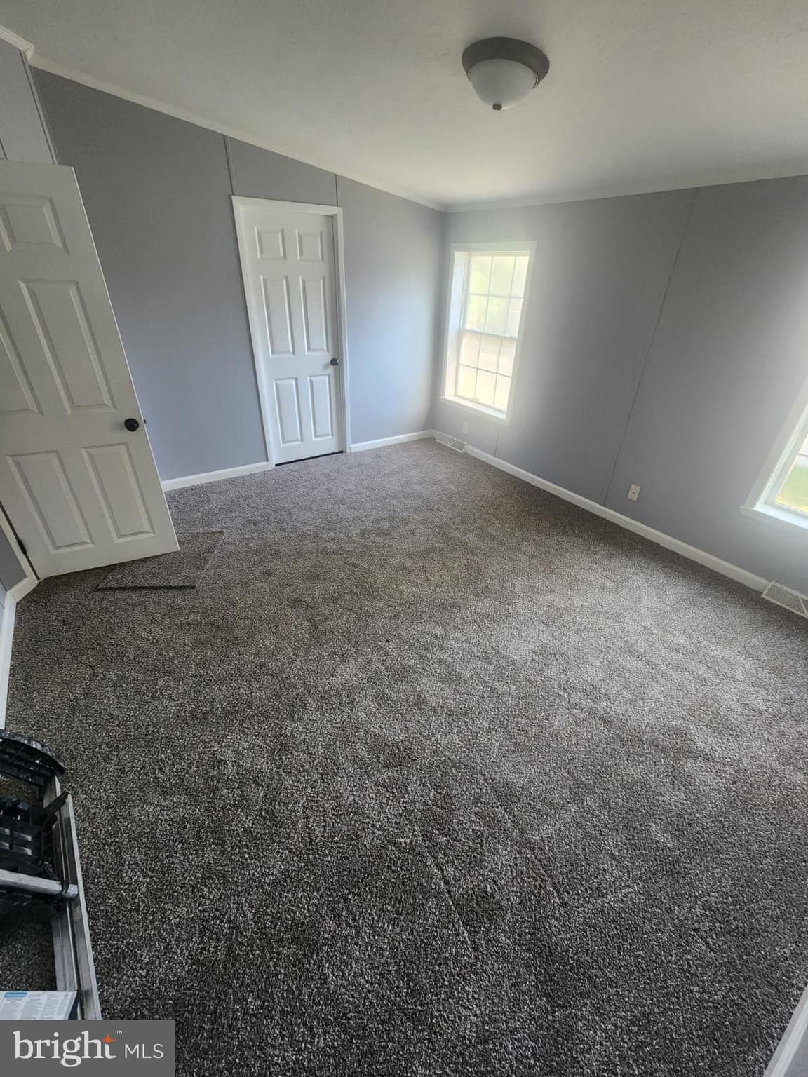 2110 Mays Landing Road, Unit 199 Millville, NJ 08332 - Photo 17 of 18 a view of an empty room and window