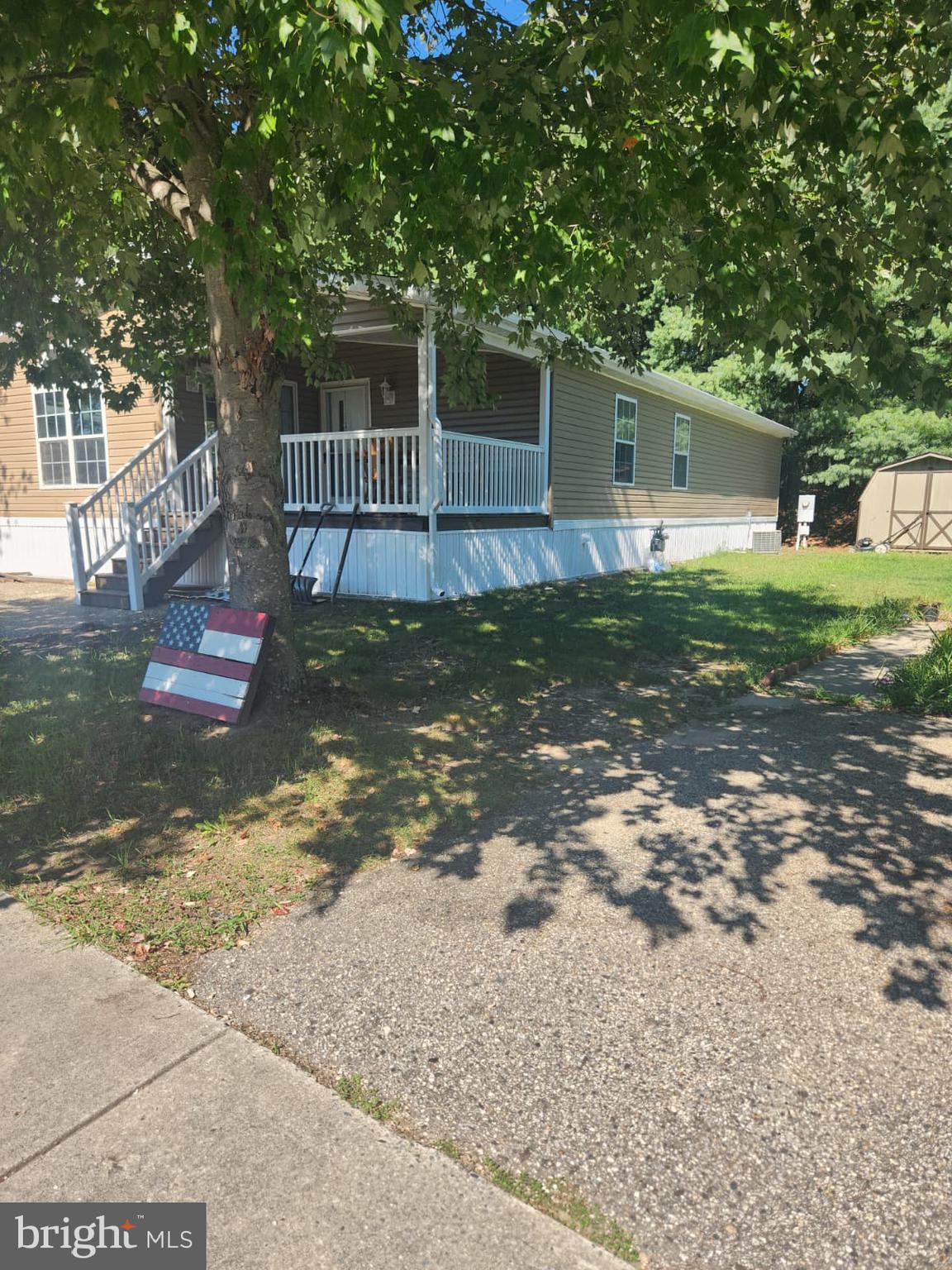2110 Mays Landing Road, Unit 199 Millville, NJ 08332 - Photo 3 of 18 a backyard of a house with lots of green space