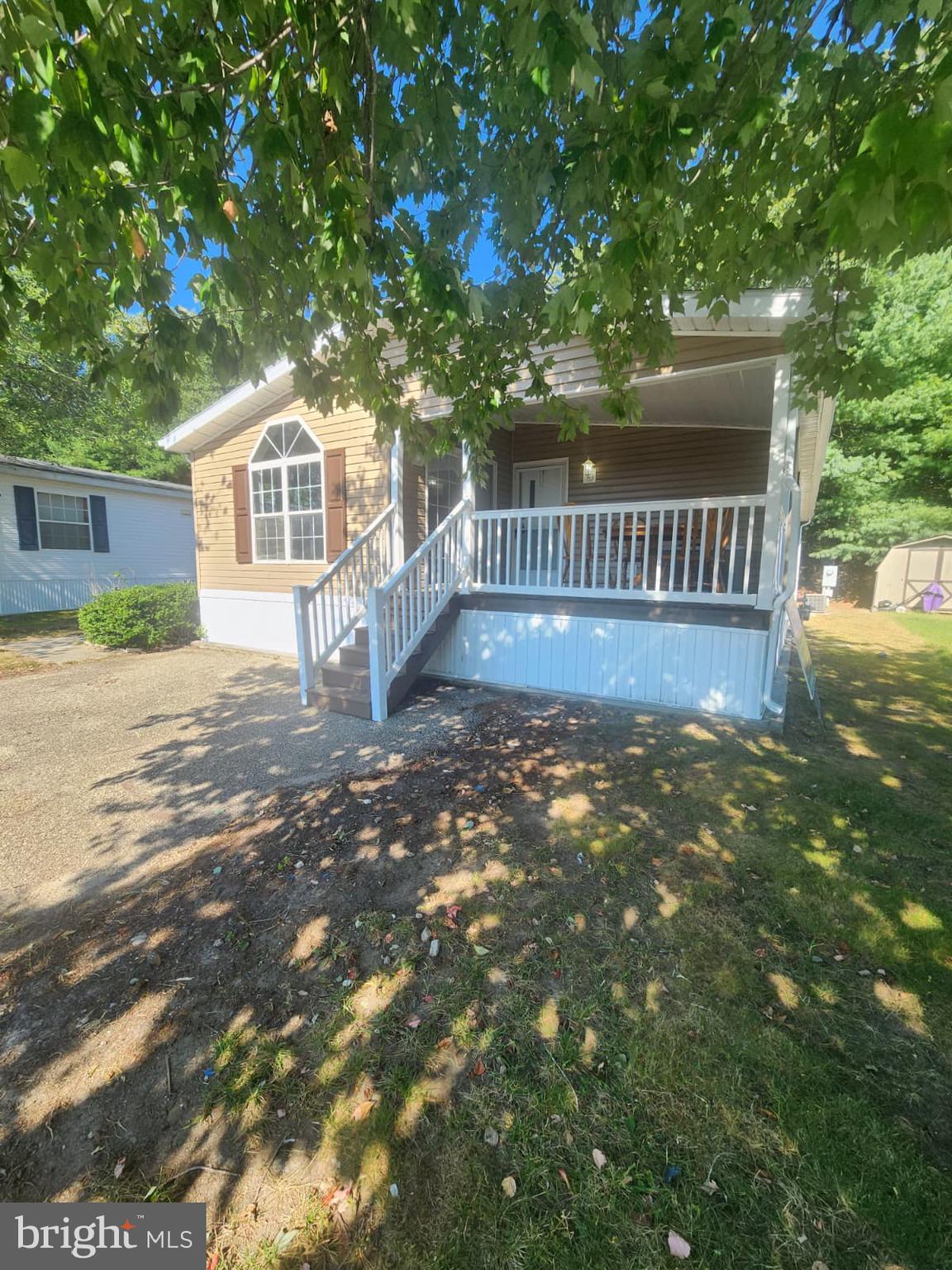 2110 Mays Landing Road, Unit 199 Millville, NJ 08332 - Photo 4 of 18 a view of a house with a yard