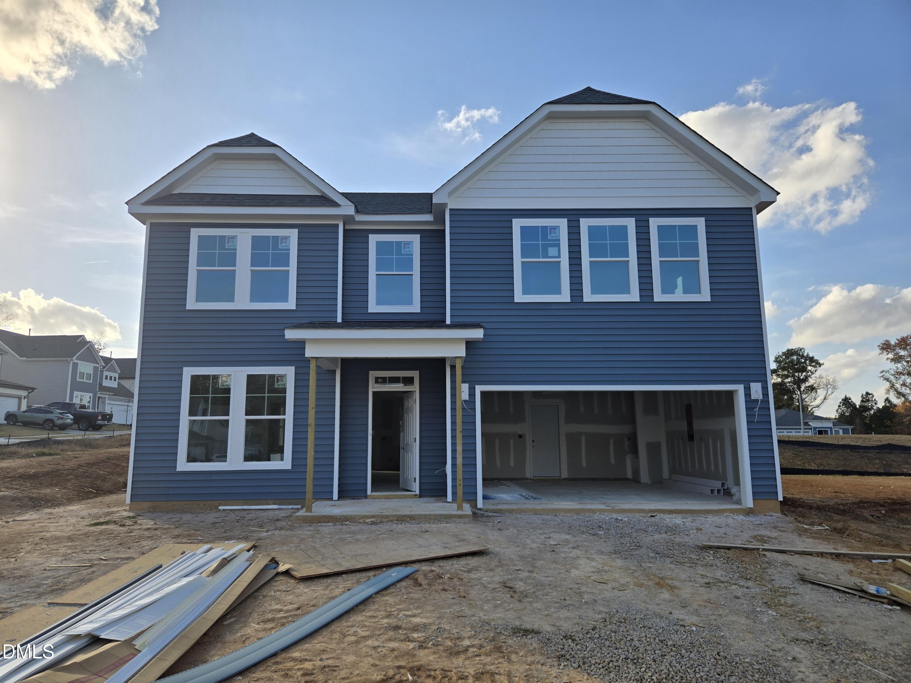116 Brooklynn Trail Angier, NC 27501 - Photo 1 of 28 a front view of a house with a yard and parking space