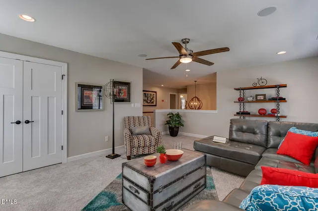 a living room with furniture and a rug