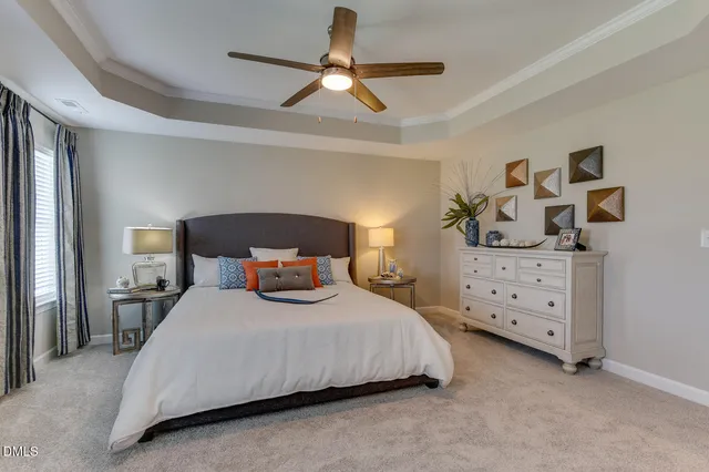 a bedroom with a bed and a cabinets