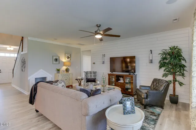 a living room with furniture and a flat screen tv