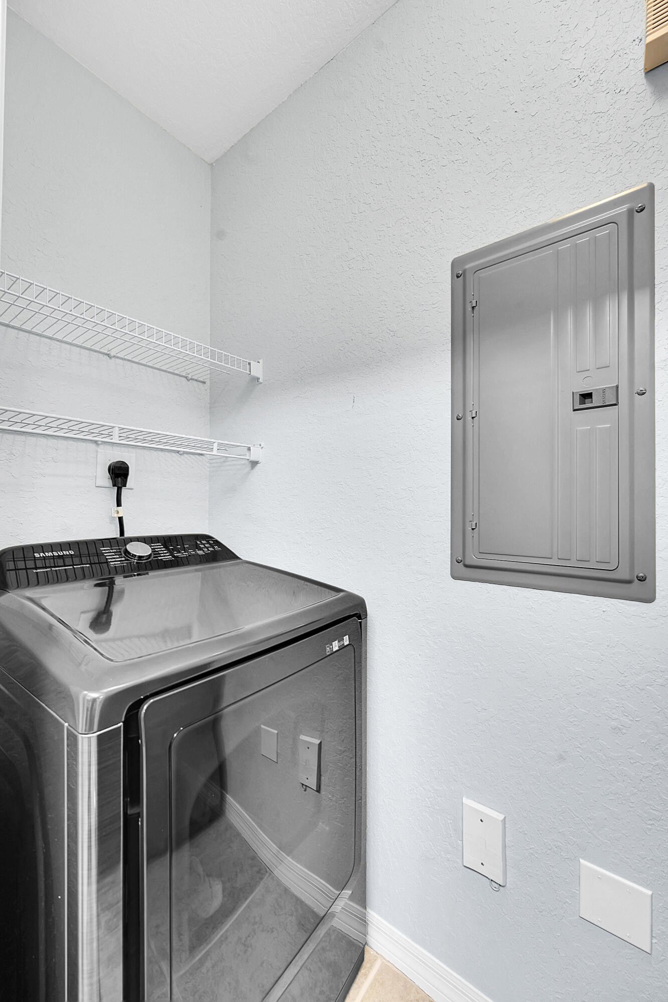 162 Southwest Peacock Boulevard, Unit 32206 Port St. Lucie, FL 34986 - Photo 12 of 24 a utility room with a sink and mirror