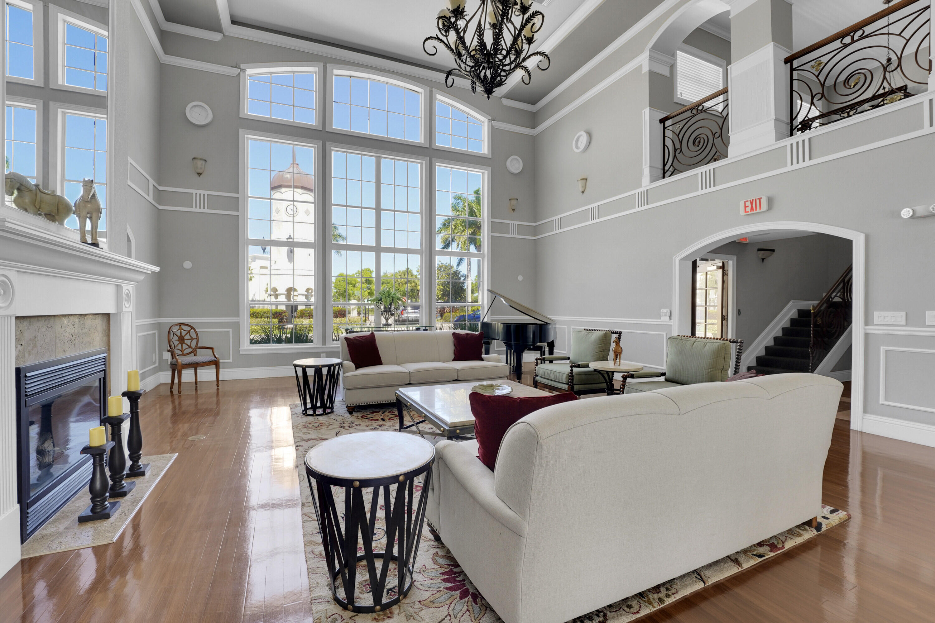 162 Southwest Peacock Boulevard, Unit 32206 Port St. Lucie, FL 34986 - Photo 19 of 24 a living room with fireplace furniture and a large window