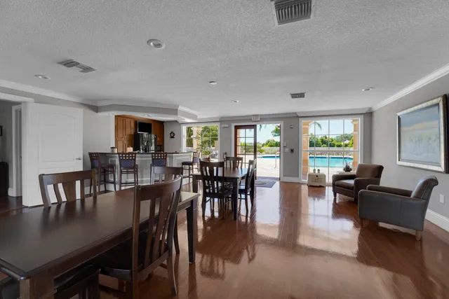 a view of a dining room with furniture window and outside view