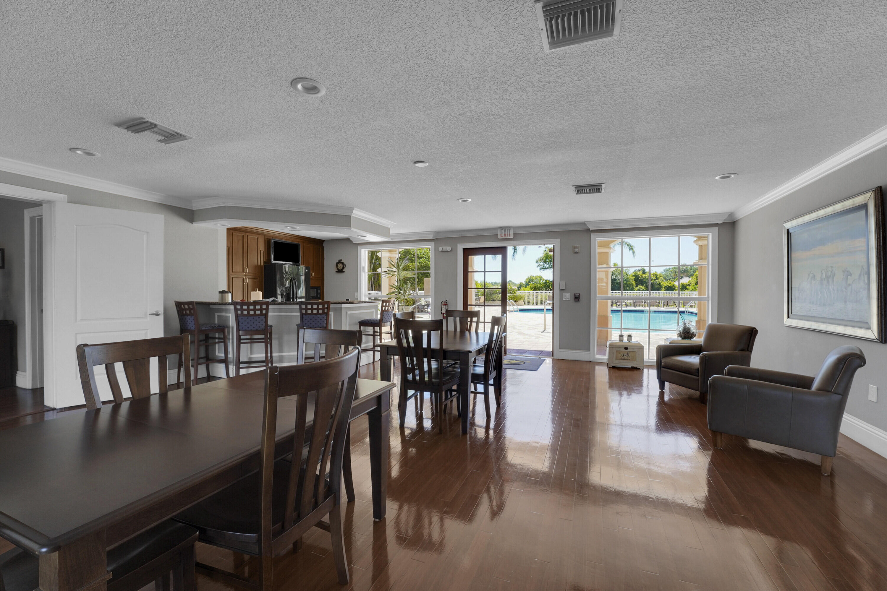 162 Southwest Peacock Boulevard, Unit 32206 Port St. Lucie, FL 34986 - Photo 20 of 24 a view of a dining room with furniture window and outside view