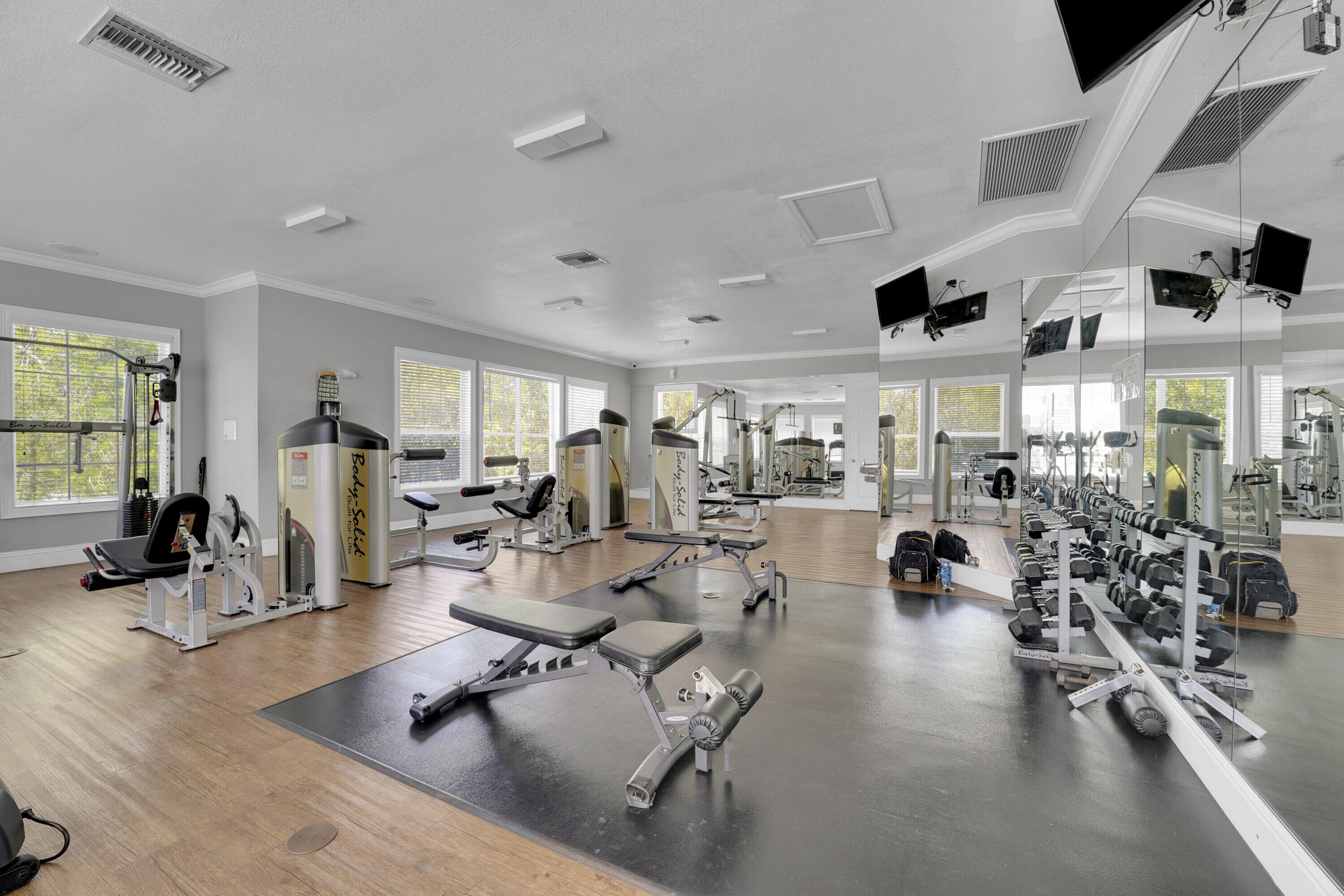 162 Southwest Peacock Boulevard, Unit 32206 Port St. Lucie, FL 34986 - Photo 22 of 24 a living room with lots of furniture and a large window