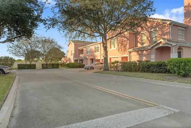 a view of a street with a building in the background