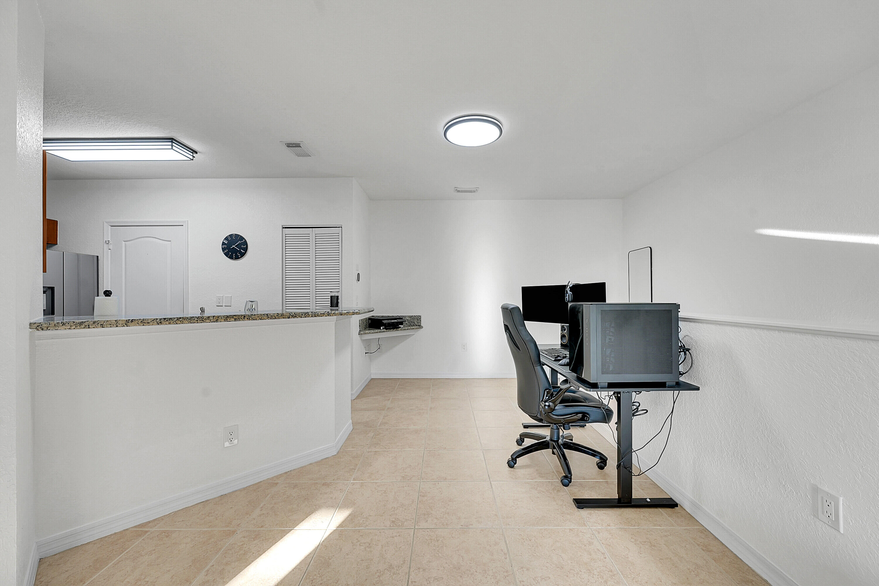 162 Southwest Peacock Boulevard, Unit 32206 Port St. Lucie, FL 34986 - Photo 6 of 24 a living room with furniture and a table