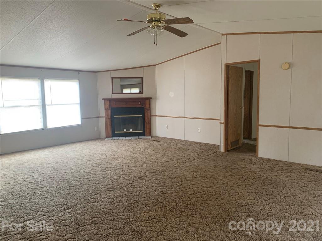 4524 Cherrystone Road Lancaster, SC 29720 - Photo 2 of 25 a view of empty room with a fireplace and windows