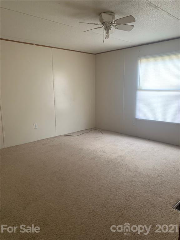 4524 Cherrystone Road Lancaster, SC 29720 - Photo 17 of 25 an empty room with a empty space and windows