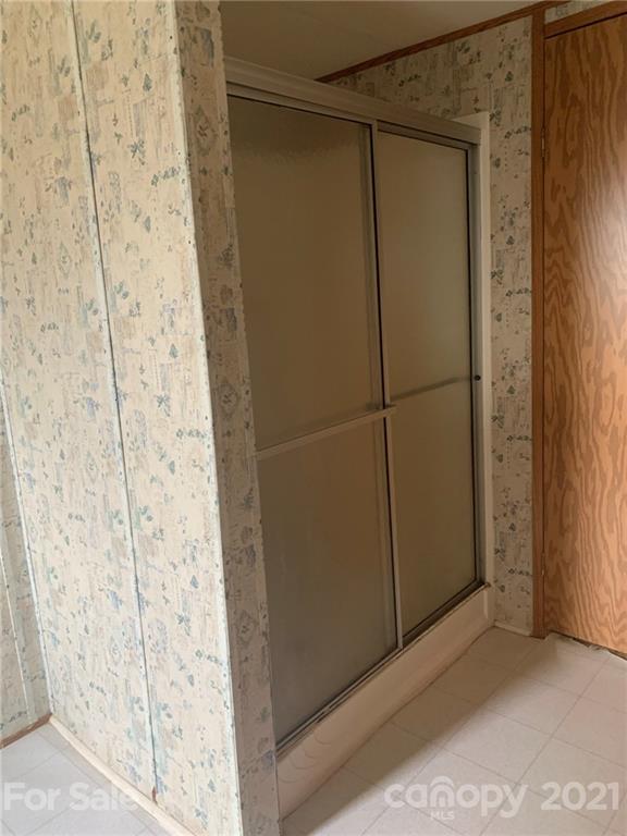 4524 Cherrystone Road Lancaster, SC 29720 - Photo 20 of 25 a bathroom with a glass door