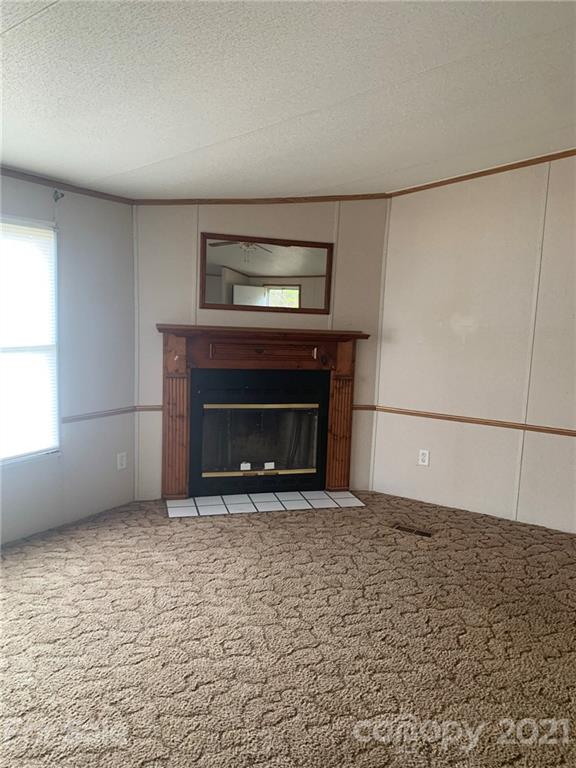 4524 Cherrystone Road Lancaster, SC 29720 - Photo 3 of 25 a living room with a fireplace