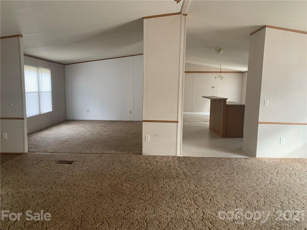 4524 Cherrystone Road Lancaster, SC 29720 - Photo 6 of 25 an empty room with windows and pillars in it
