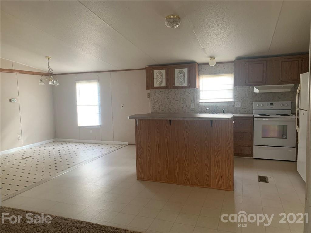 4524 Cherrystone Road Lancaster, SC 29720 - Photo 8 of 25 a view of a kitchen with a sink dishwasher and a refrigerator