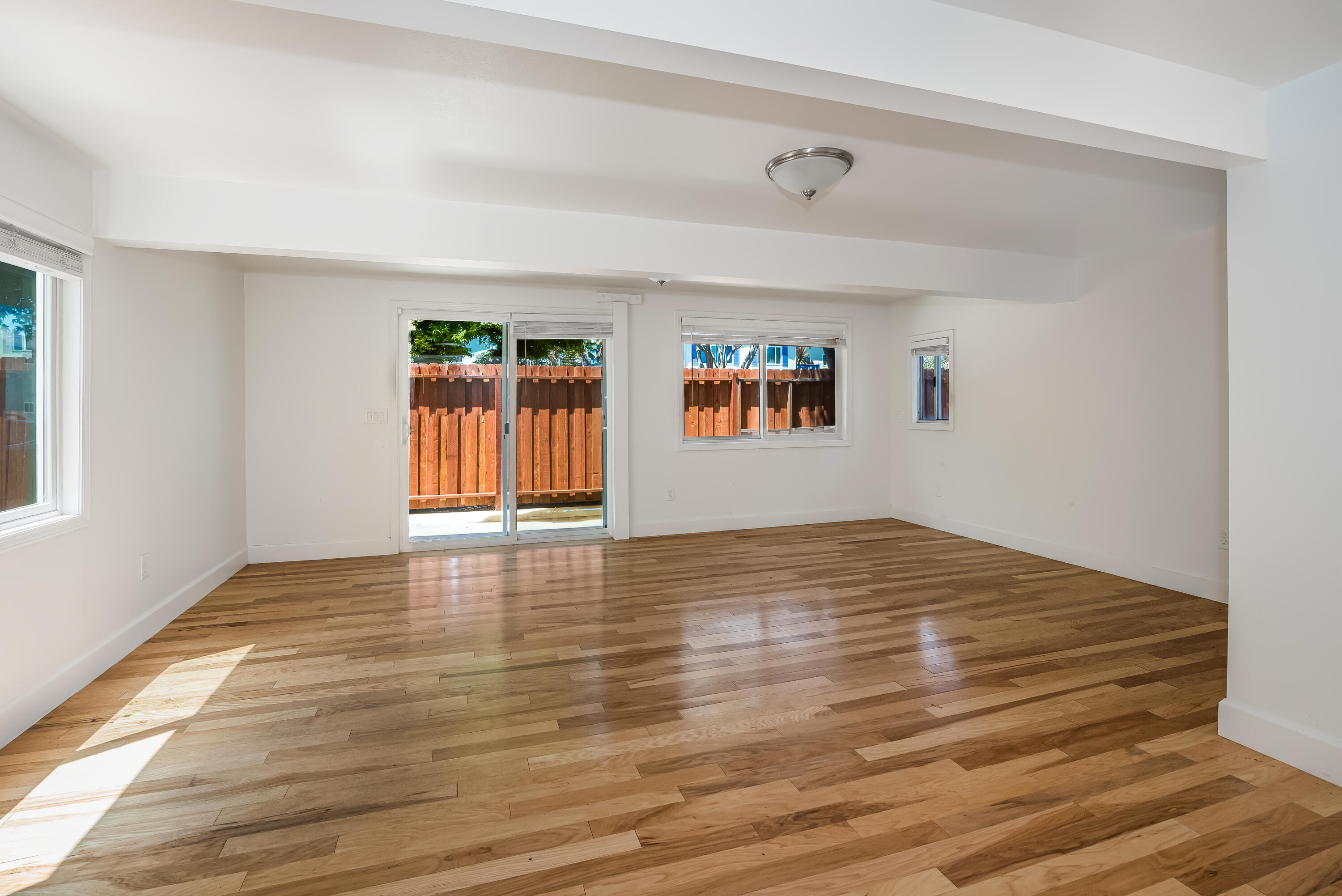 6711 Sabado Tarde Road Goleta, CA 93117 - Photo 3 of 9 a view of empty room with wooden floor and fan