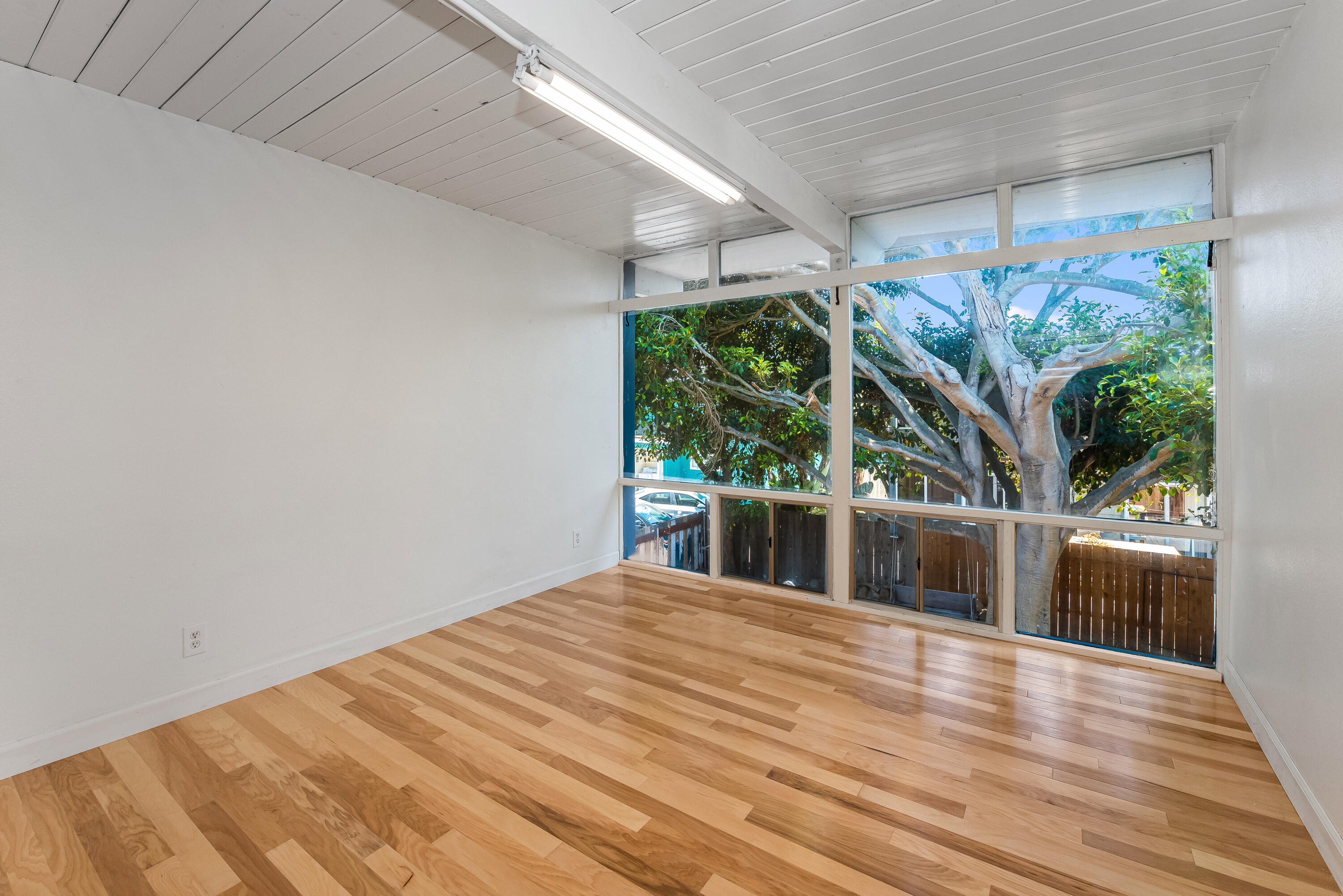 6711 Sabado Tarde Road Goleta, CA 93117 - Photo 6 of 9 a view of backyard with potted plants and wooden floor