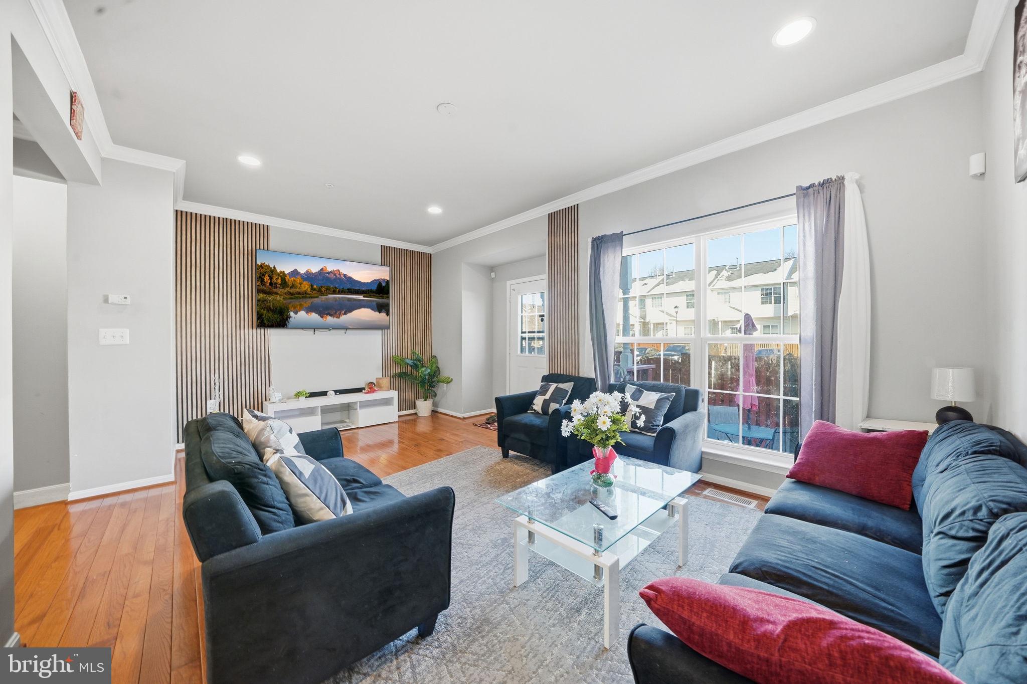 15420 Kennett Square Way Brandywine, MD 20613 - Photo 13 of 32 a living room with furniture and a large window