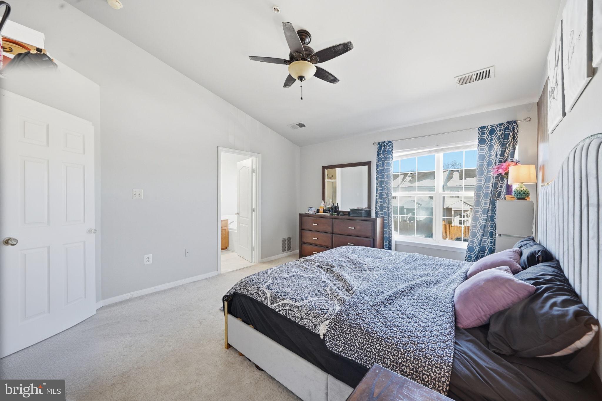 15420 Kennett Square Way Brandywine, MD 20613 - Photo 16 of 32 a bedroom with a bed dresser and a window