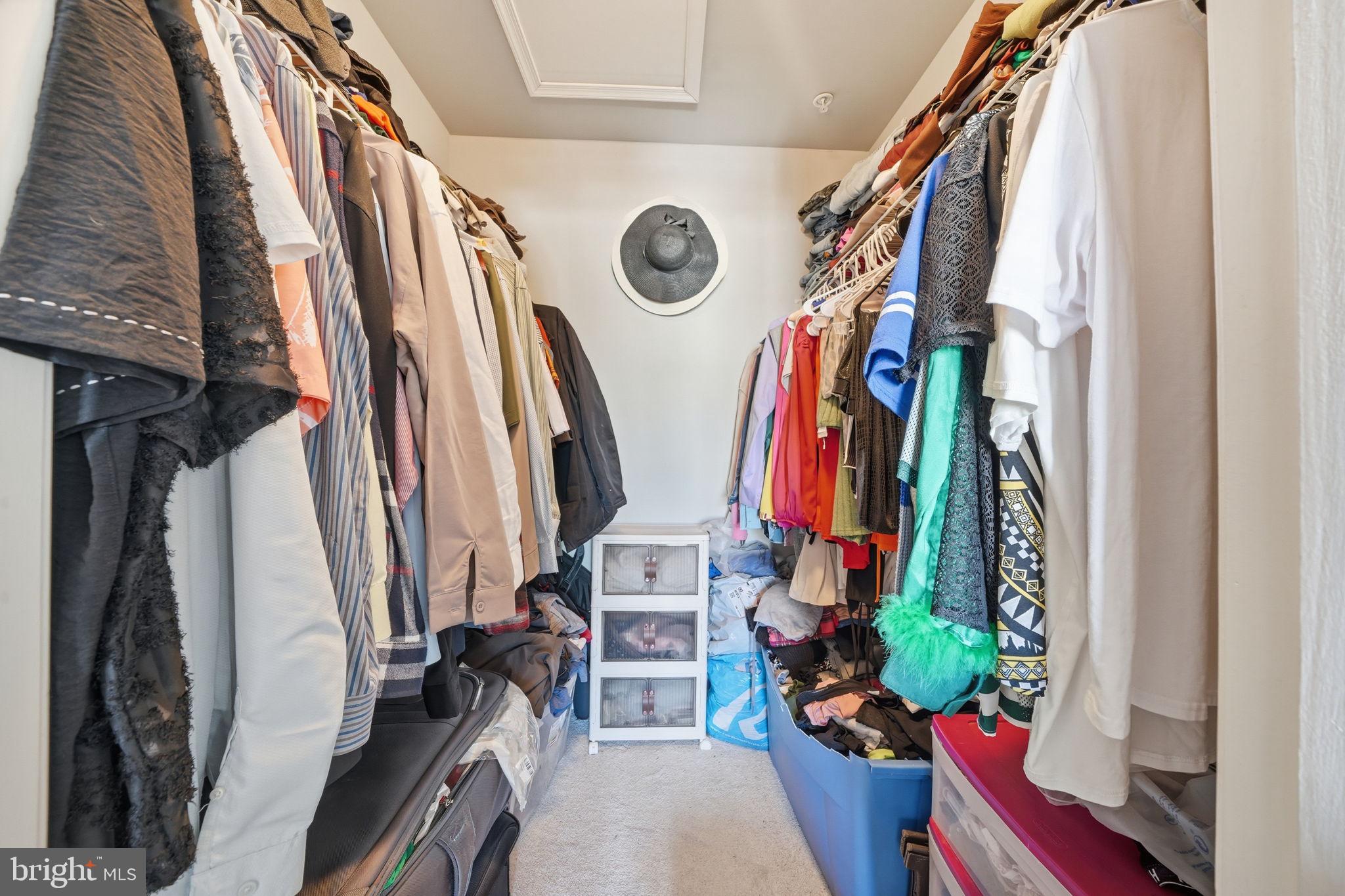 15420 Kennett Square Way Brandywine, MD 20613 - Photo 19 of 32 a view of walk in closet with clothes and shoes