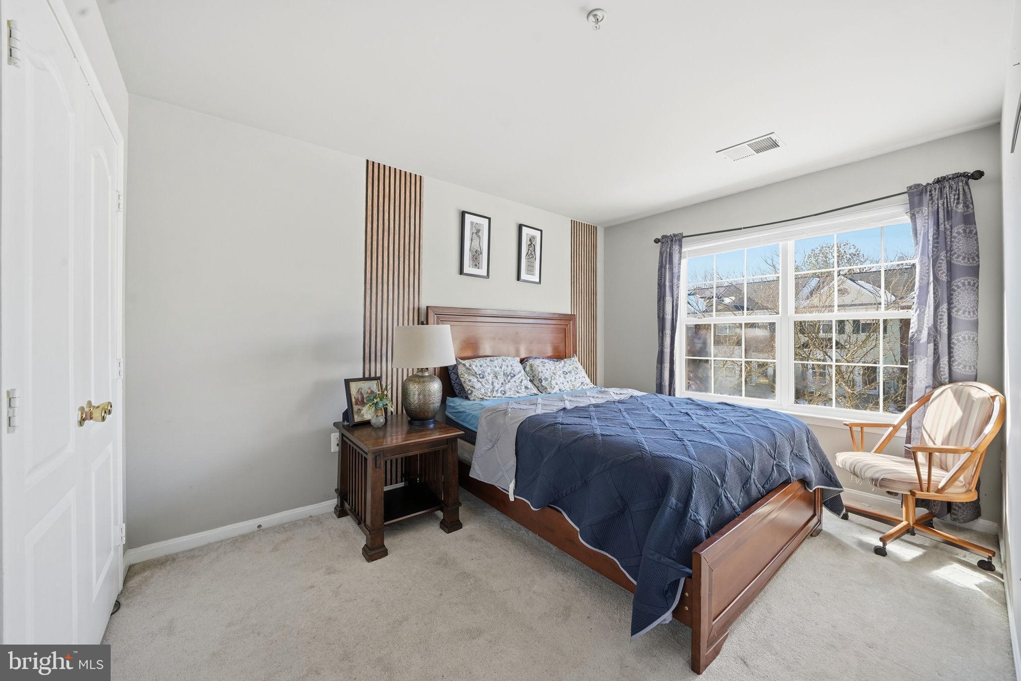 15420 Kennett Square Way Brandywine, MD 20613 - Photo 20 of 32 a bedroom with a bed and a window