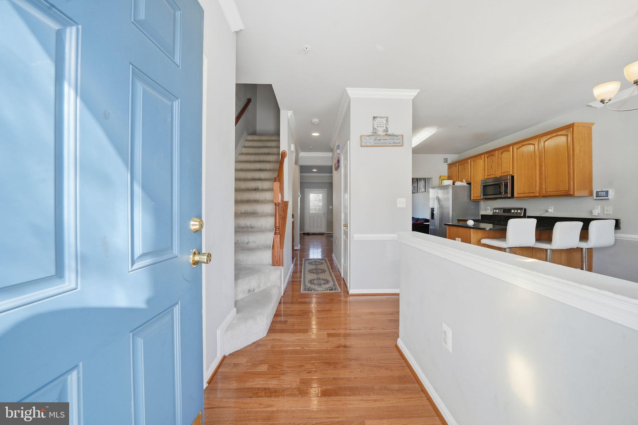 15420 Kennett Square Way Brandywine, MD 20613 - Photo 5 of 32 a view of a kitchen from the hallway