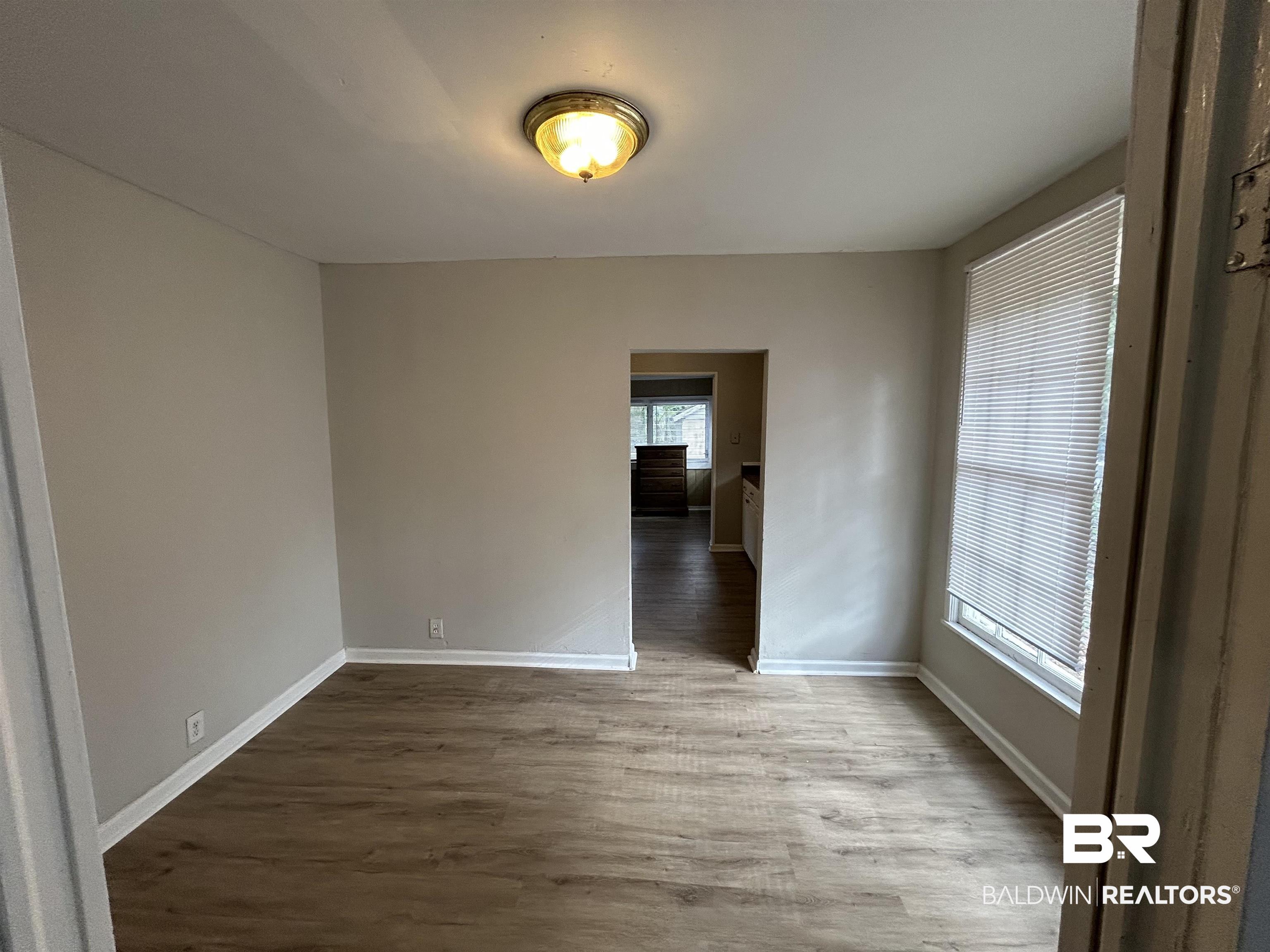 2119 Hoppin Street Mobile, AL 36605 - Photo 19 of 23 Unfurnished room featuring wood-type flooring