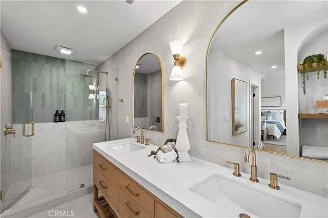a bathroom with a double vanity sink mirror and double