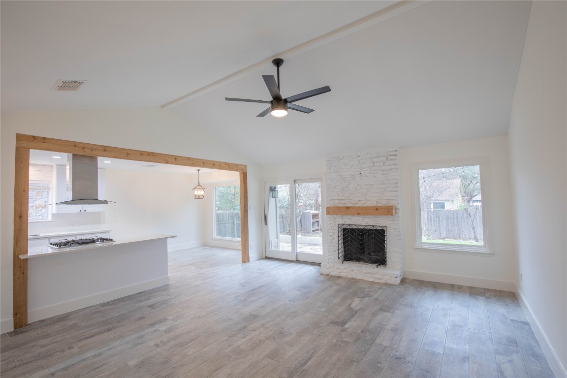 6009 Smith Oak Trail Austin, TX 78749 - Photo 1 of 1 wooden floor fireplace and windows in an empty room