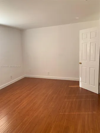 a white toilet sitting next to a bath tub shower