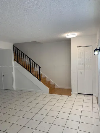 a kitchen with a sink a stove and refrigerator