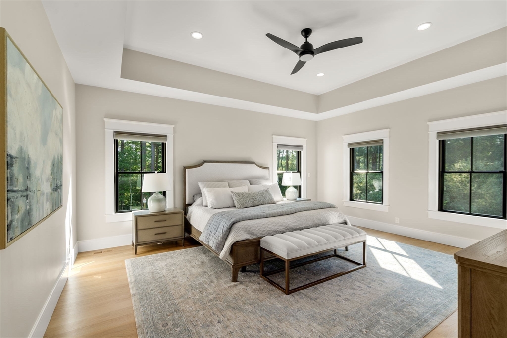 12 Ariana Lane Norfolk, MA 02056 - Photo 13 of 41 a bedroom with a large bed couch and windows