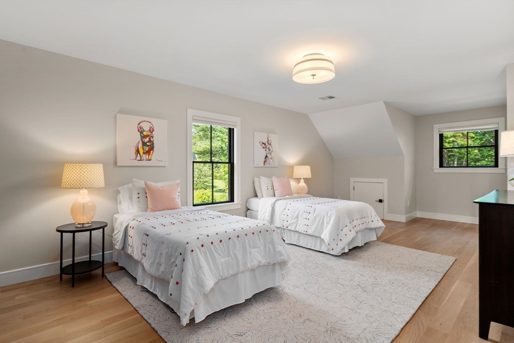 12 Ariana Lane Norfolk, MA 02056 - Photo 24 of 41 a bedroom with a bed and a night stand