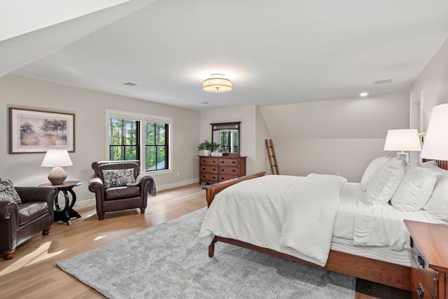 a bedroom with a bed and furniture