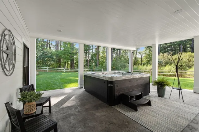 a living room with couch and a garden