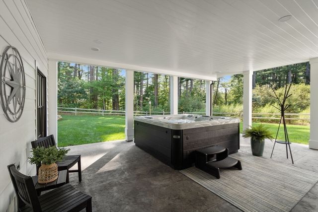 a living room with couch and a garden