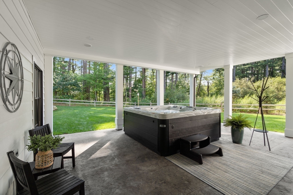 12 Ariana Lane Norfolk, MA 02056 - Photo 33 of 41 a living room with couch and a garden