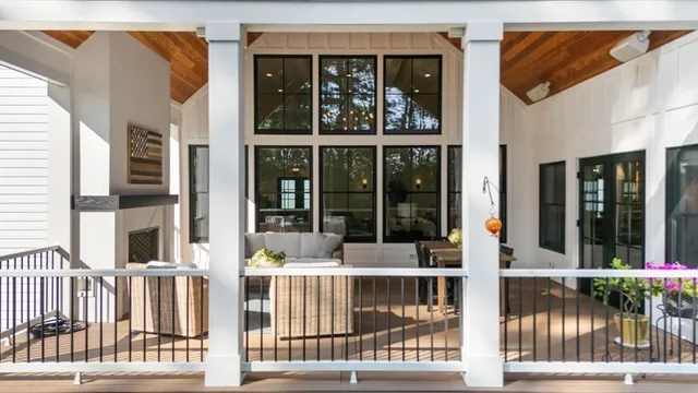 a view of a brick house with large windows
