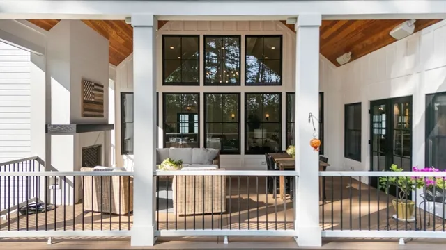 a view of a brick house with large windows