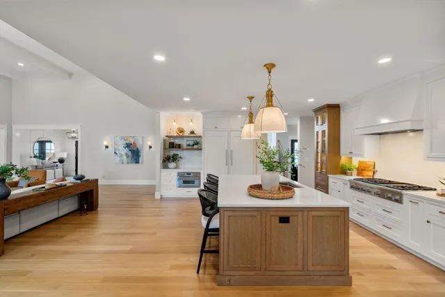 a view of kitchen with sink dining table and chairs