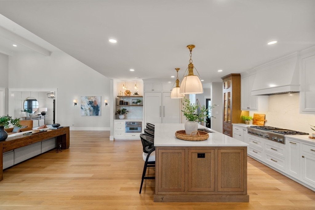 12 Ariana Lane Norfolk, MA 02056 - Photo 6 of 41 a view of kitchen with sink dining table and chairs