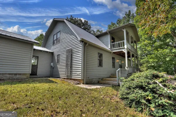 a house with trees in front of it
