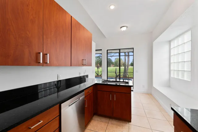 a kitchen with a sink and a window
